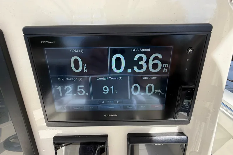 Slide: The Image of Garmin GPS display on 1976 SeaCraft SC 23 Classic showing RPM, speed, voltage, and temperature. - 27