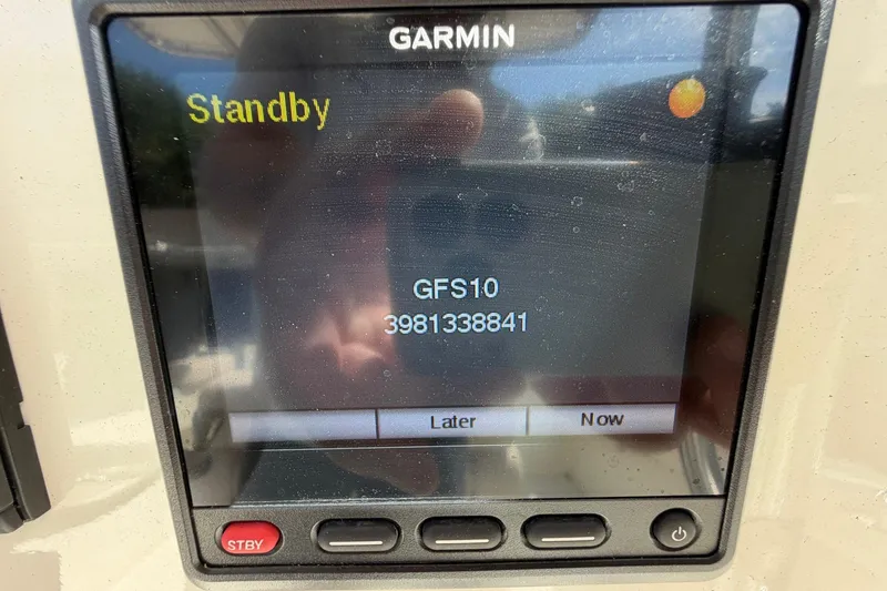 Slide: The Image of Garmin display on 1976 SeaCraft SC 23 Classic showing standby mode and GFS10 message. - 28