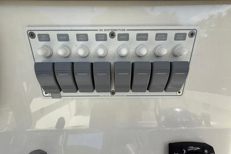 Slide: The Image of Control panel of a 1976 SeaCraft SC 23 Classic boat with labeled switches. - 30