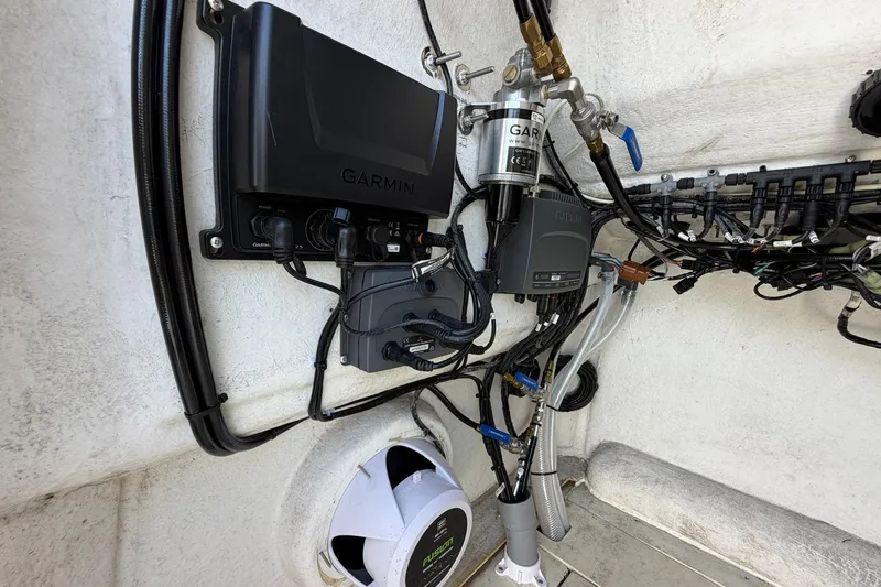 Slide: The Image of Electrical setup inside a 1976 SeaCraft SC 23 Classic boat featuring Garmin equipment. - 37