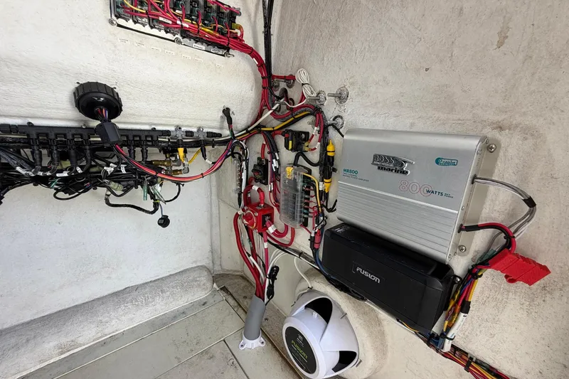 Slide: The Image of Electrical system setup in a 1976 SeaCraft SC 23 Classic boat, featuring wiring and components. - 38