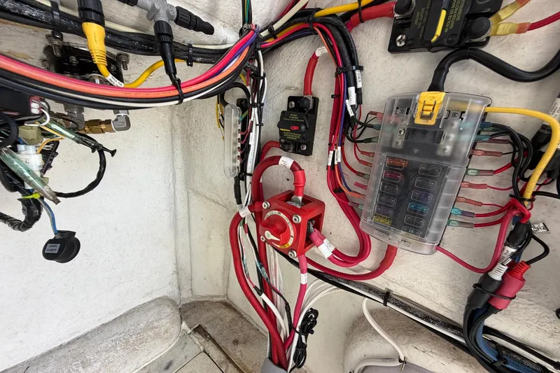 Slide: The Image of Electrical wiring and fuse box inside a 1976 SeaCraft SC 23 Classic boat. - 39