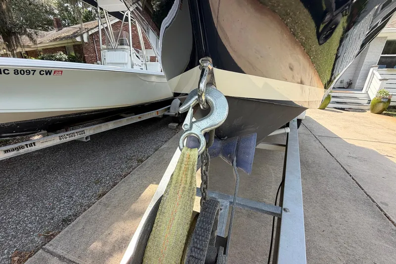 Slide: The Image of 1976 SeaCraft SC 23 Classic boat on trailer, close-up of bow and winch strap. - 7