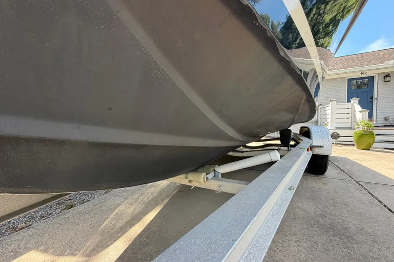 Slide: The Image of 1976 SeaCraft SC 23 Classic boat on trailer, parked in driveway near house. - 8