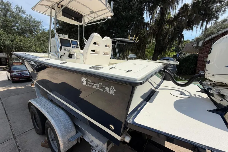 Slide: The Image of 1976 SeaCraft SC 23 Classic boat on trailer, featuring sleek design and modern equipment. - 9
