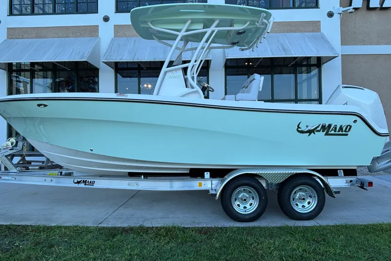 The Image of 2026 Mako 226 Center Console boat on trailer, parked outside a building. - 0