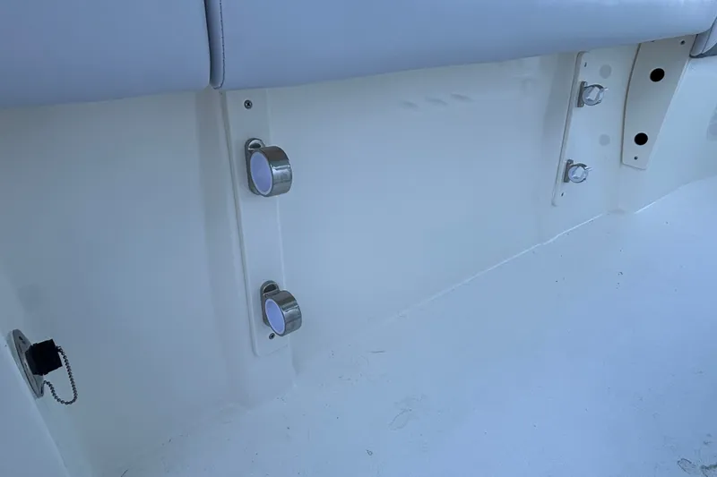 Slide: The Image of Interior view of 2026 Mako 226 Center Console boat, featuring stainless steel fixtures. - 12