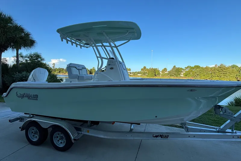 Slide: The Image of 2026 Mako 226 Center Console boat on trailer, parked outdoors. - 2