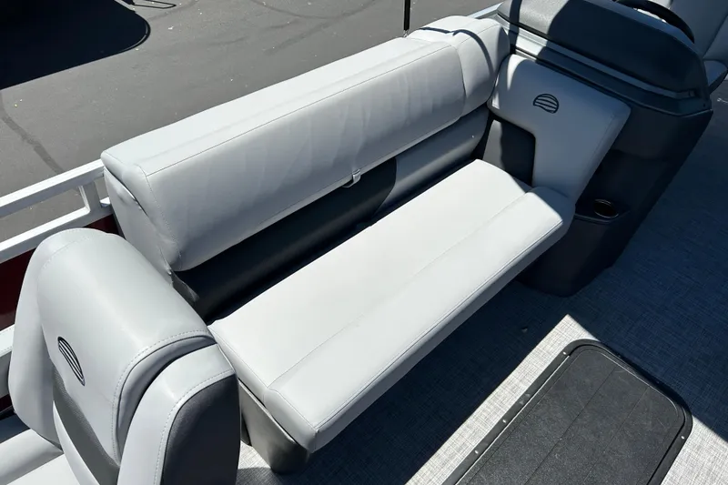 Slide: The Image of 2026 Sun Tracker Sportfish 24 XP3 boat interior with gray cushioned seating. - 12