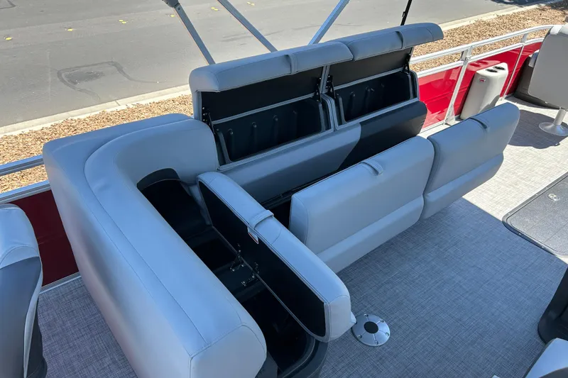 Slide: The Image of 2026 Sun Tracker Sportfish 24 XP3 boat interior with open storage compartments. - 16