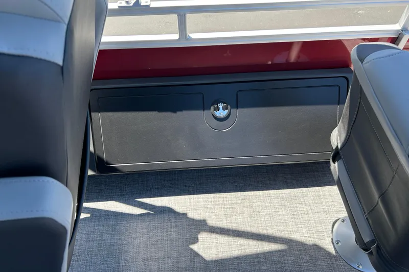 Slide: The Image of 2026 Sun Tracker Sportfish 24 XP3 interior seating and storage compartment. - 28