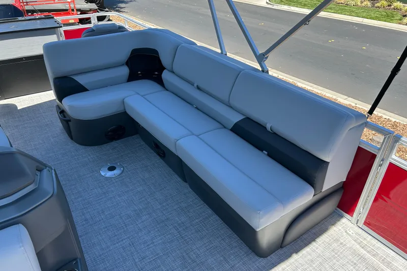 Slide: The Image of 2026 Sun Tracker Sportfish 24 XP3 pontoon boat with spacious gray seating. - 17