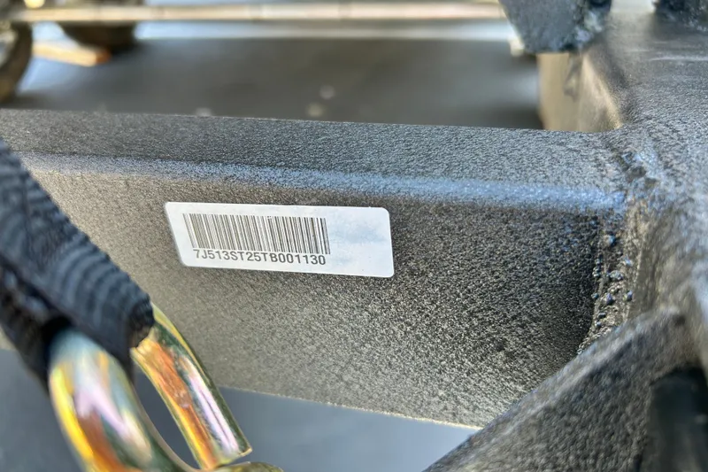 Slide: The Image of Close-up of a barcode on a 2026 Sun Tracker Sportfish 24 XP3 boat. - 128