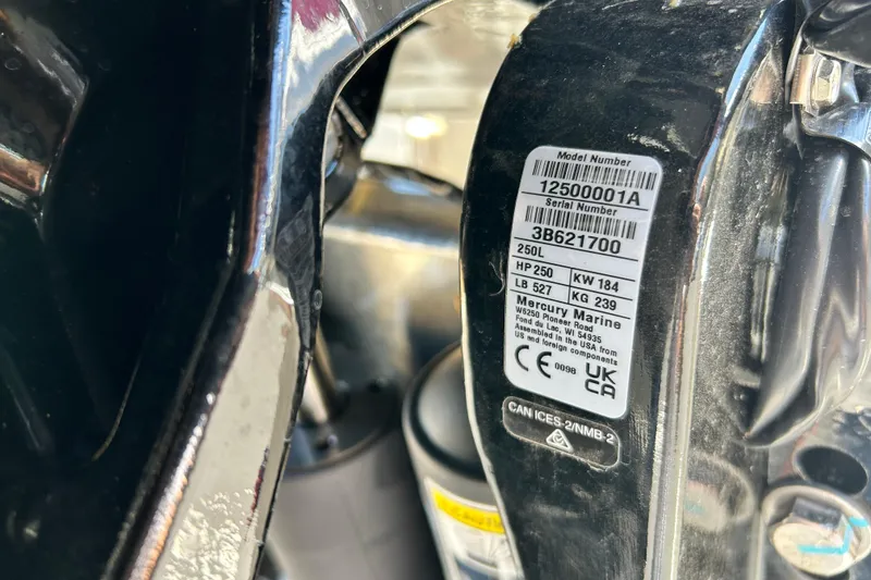 Slide: The Image of Label on Mercury Marine engine, model 12500001A, serial 3B621700, on Sun Tracker Sportfish 24 XP3. - 127