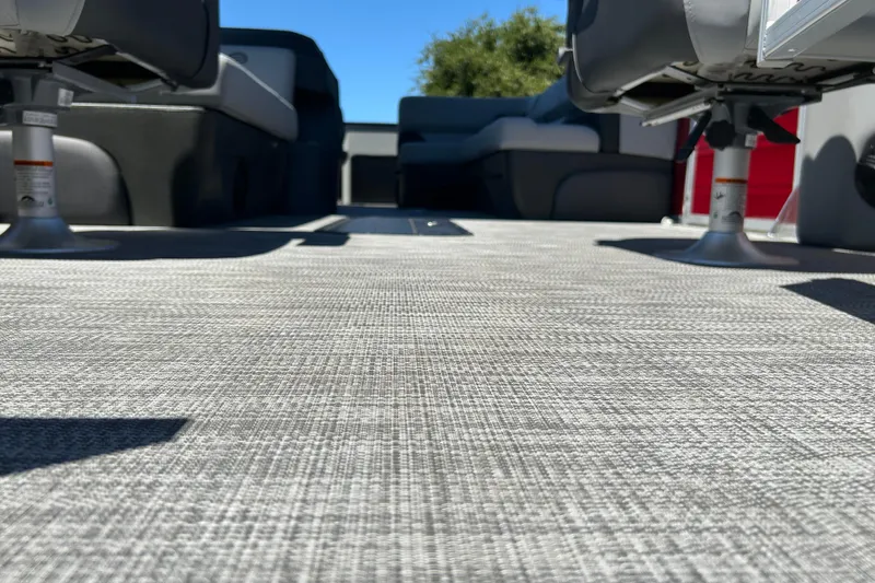 Slide: The Image of 2026 Sun Tracker Sportfish 24 XP3 interior with textured flooring and seating. - 40