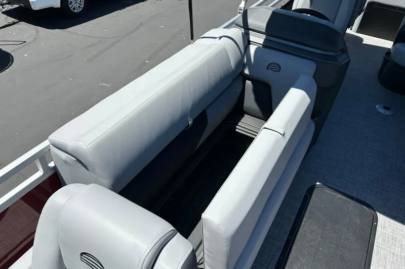 Slide: The Image of 2026 Sun Tracker Sportfish 24 XP3 boat interior with gray seating and deck. - 14