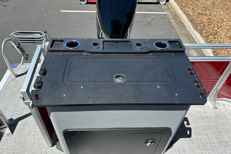 Slide: The Image of Sun Tracker Sportfish 24 XP3 2026 boat deck with fishing station and cup holders. - 21