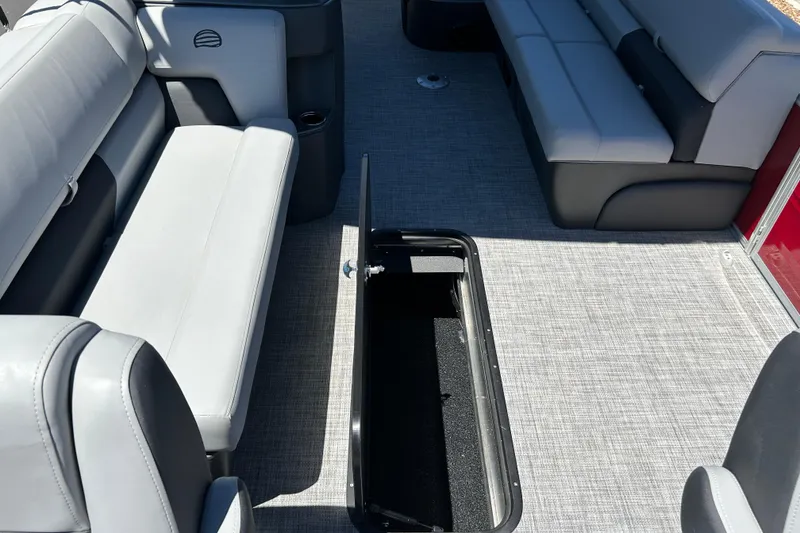 Slide: The Image of Interior of 2026 Sun Tracker Sportfish 24 XP3 boat with open storage compartment. - 34