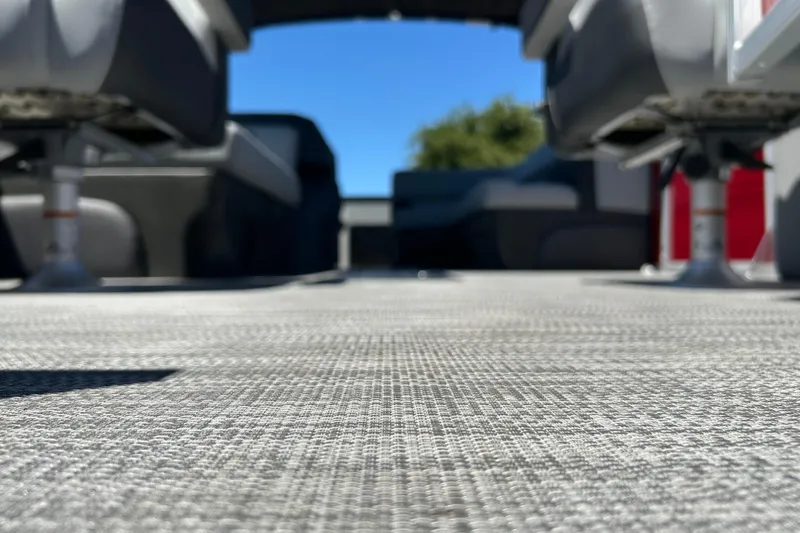 Slide: The Image of Interior view of 2026 Sun Tracker Sportfish 24 XP3 boat, focusing on textured flooring. - 39