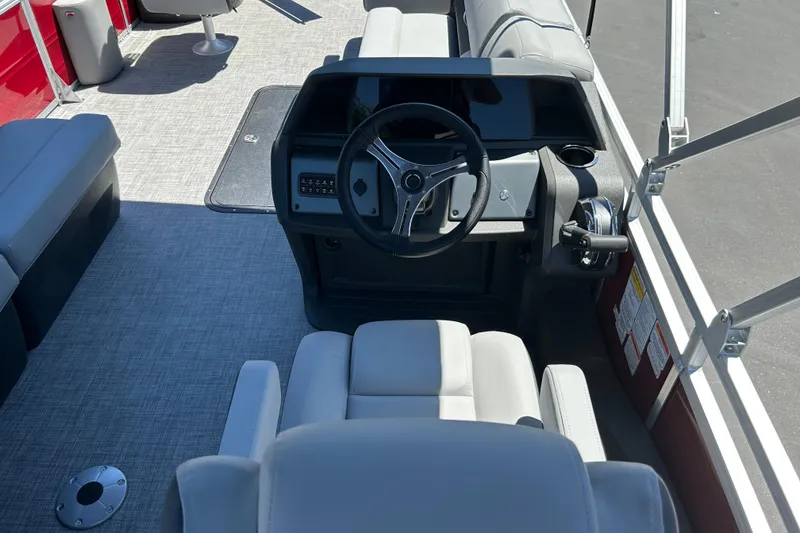 Slide: The Image of Interior view of 2026 Sun Tracker Sportfish 24 XP3 boat with steering console. - 30