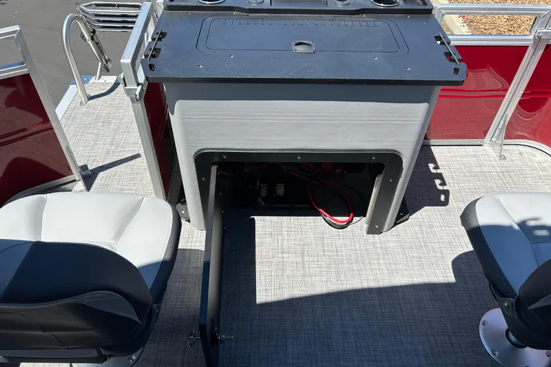Slide: The Image of Interior of 2026 Sun Tracker Sportfish 24 XP3 boat with seating and storage area. - 27