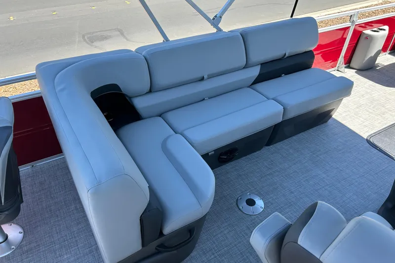 Slide: The Image of Luxurious seating on 2026 Sun Tracker Sportfish 24 XP3 pontoon boat, featuring sleek gray upholstery. - 18
