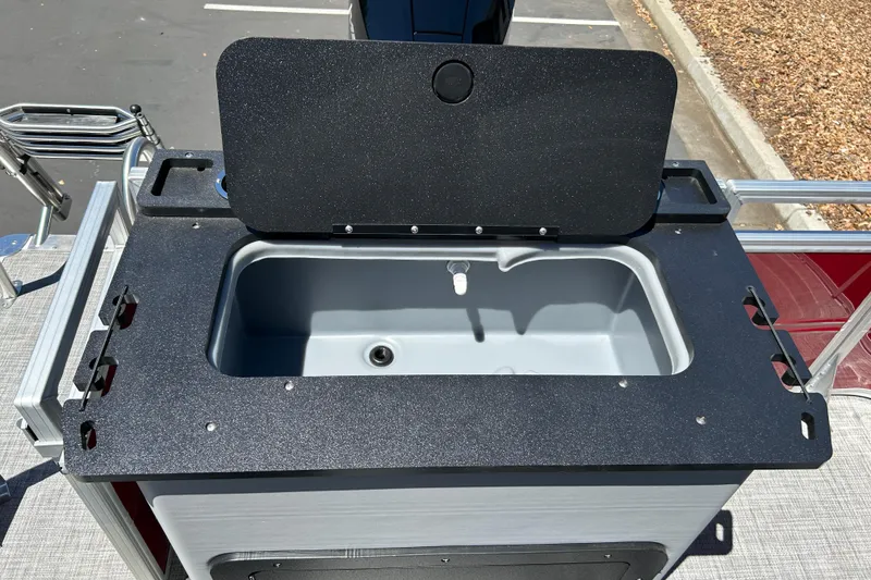 Slide: The Image of 2026 Sun Tracker Sportfish 24 XP3 boat sink with open lid, showcasing sleek design. - 22