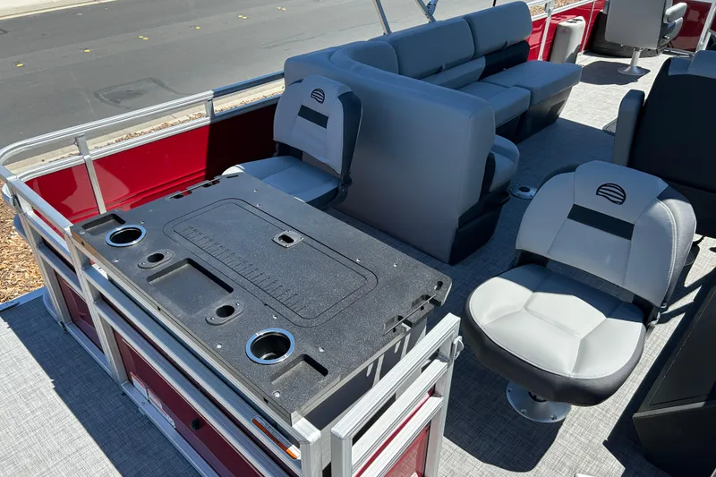 Slide: The Image of 2026 Sun Tracker Sportfish 24 XP3 pontoon boat interior with seating and fishing station. - 20