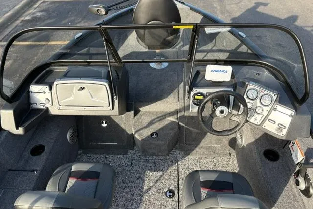 Slide: The Image of 2026 Tracker Pro Guide V-175 WT boat interior with steering wheel and dashboard controls. - 13