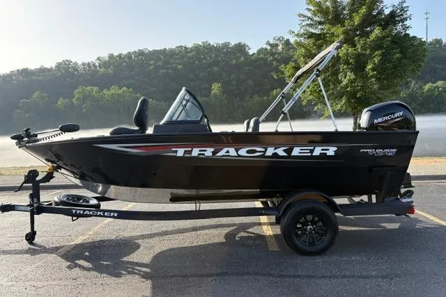 Slide: The Image of 2026 Tracker Pro Guide V-175 WT boat on trailer, parked outdoors. - 10