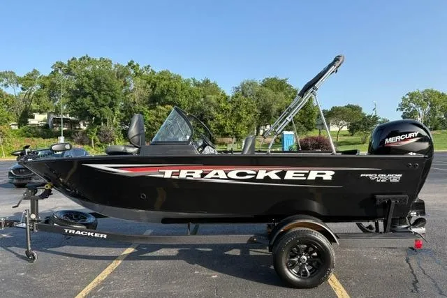 Slide: The Image of 2026 Tracker Pro Guide V-175 WT boat with Mercury engine on trailer in parking lot. - 20