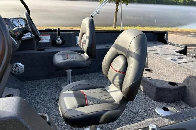Slide: The Image of 2026 Tracker Pro Guide V-175 WT boat interior with comfortable seating and modern dashboard. - 22