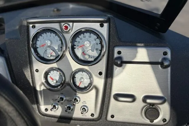 Slide: The Image of Dashboard of 2026 Tracker Pro Guide V-175 WT boat with gauges and controls. - 16
