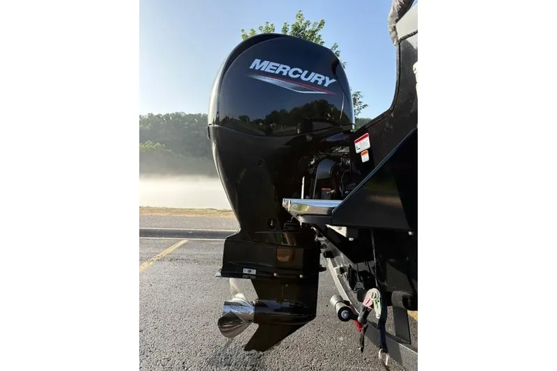 Slide: The Image of 2026 Tracker Pro Guide V-175 WT with Mercury outboard motor on a sunny day. - 21