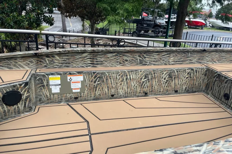 Slide: The Image of 2026 Tracker Grizzly 1650 T Prairie Wings Edition boat with camouflage interior design. - 8