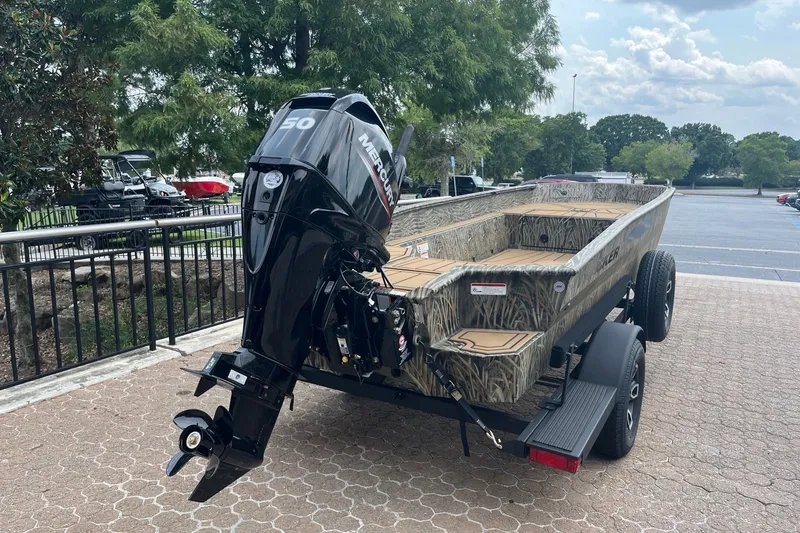 Slide: The Image of 2026 Tracker Grizzly 1650 T Prairie Wings Edition boat with Mercury outboard motor. - 5
