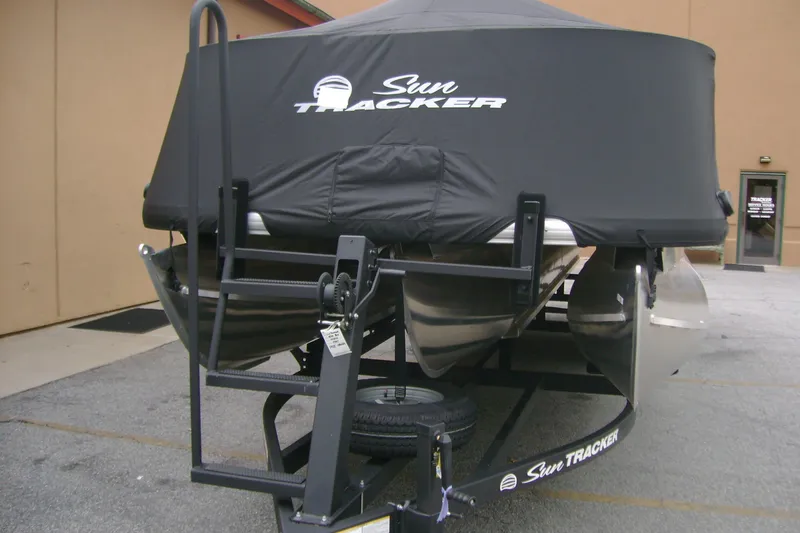 Slide: The Image of 2026 Sun Tracker Sportfish 24 XP3 pontoon boat with cover on trailer. - 9
