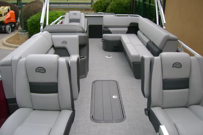 Slide: The Image of 2026 Sun Tracker Sportfish 24 XP3 pontoon boat interior with gray seating and spacious layout. - 10