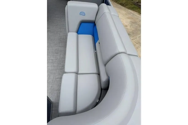 Slide: The Image of 2026 Sun Tracker Party Barge 20 DLX interior seating with gray and blue upholstery. - 15