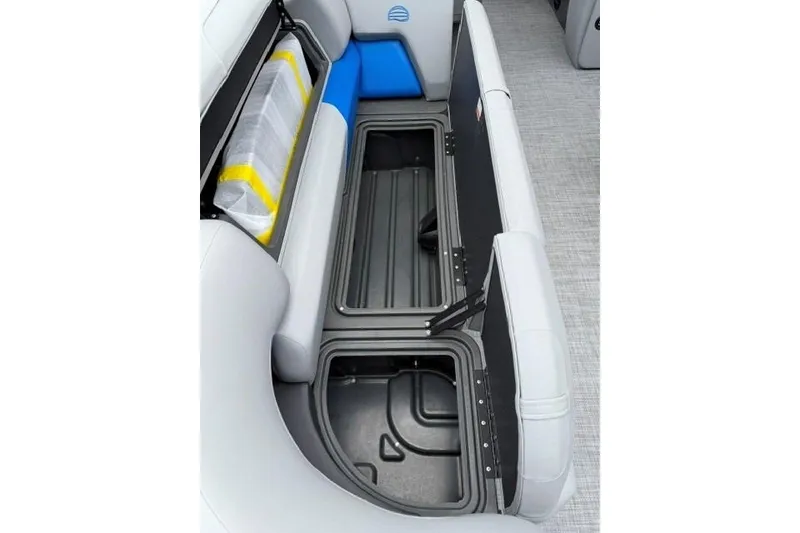 Slide: The Image of Sun Tracker Party Barge 20 DLX 2026 storage compartments with open seating and safety equipment. - 14
