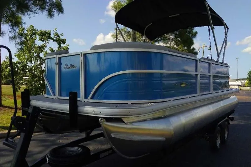 The Image of 2026 Sun Tracker Party Barge 20 DLX pontoon boat with blue exterior and canopy. - 0