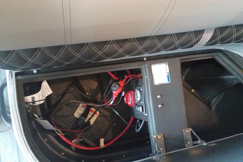 Slide: The Image of Under-seat storage with battery and wiring in 2026 Ranger 223FC boat. - 7