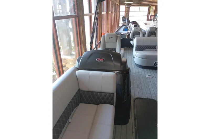 Slide: The Image of 2026 Ranger 223FC boat interior with plush seating and modern design. - 4