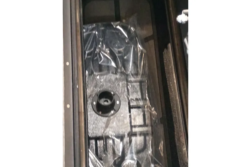 Slide: The Image of 2026 Ranger 223FC fuel tank, wrapped in protective plastic, inside a compartment. - 5