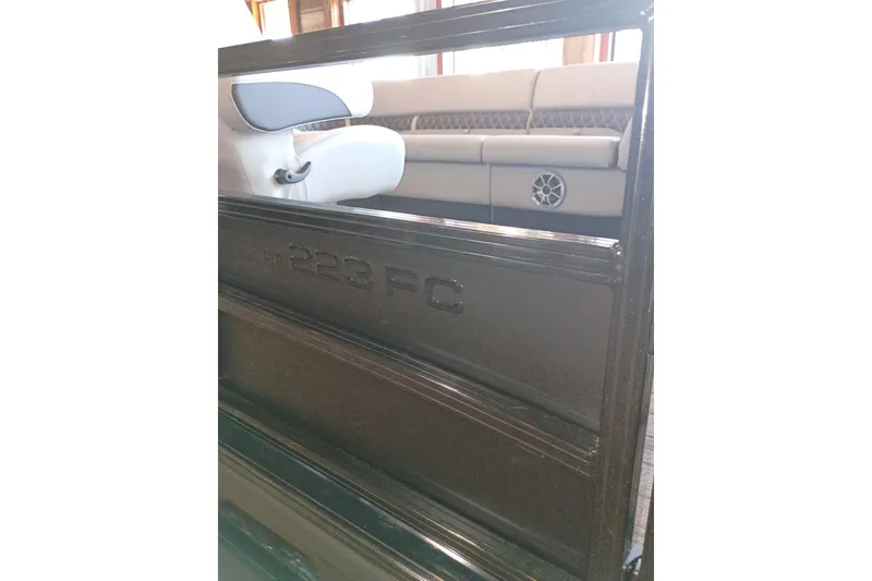 Slide: The Image of 2026 Ranger 223FC boat interior with seating and speaker detail. - 8