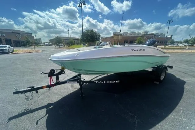 The Image of 2026 Tahoe T16 boat on trailer under a bright blue sky. - 0