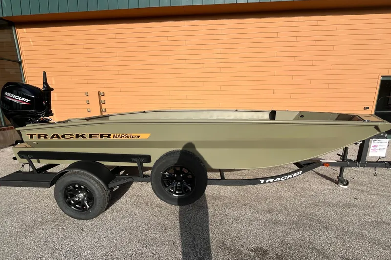 The Image of 2026 Tracker Grizzly 1756 T Marsh boat on trailer, parked outdoors. - 0