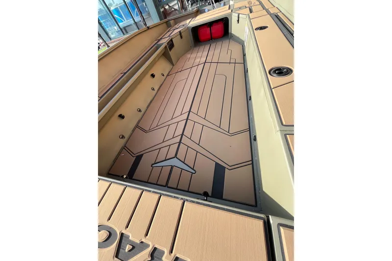 Slide: The Image of 2026 Tracker Grizzly 1756 T Marsh boat interior with custom flooring design. - 6