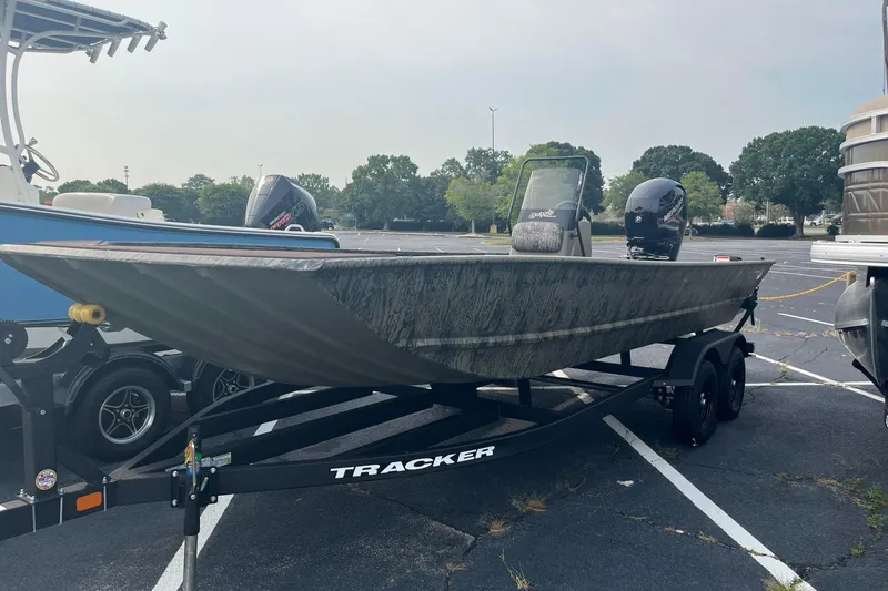 The Image of 2026 Tracker Grizzly 2072 CC boat on trailer in parking lot. - 0