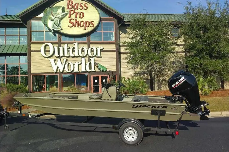 Slide: The Image of 2026 Tracker Grizzly 1860 CC boat outside Bass Pro Shops Outdoor World. - 5